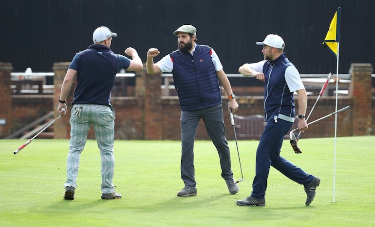 golfers-smiling-green-putt-illustration Photo by Warren Little / GETTY IMAGES EUROPE / Getty 