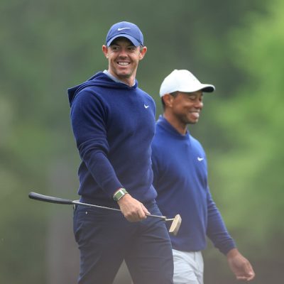 Rory McIlroy of Northern Ireland and Tiger Woods Photo by DAVID CANNON / David Cannon Collection / Getty Images via AFP