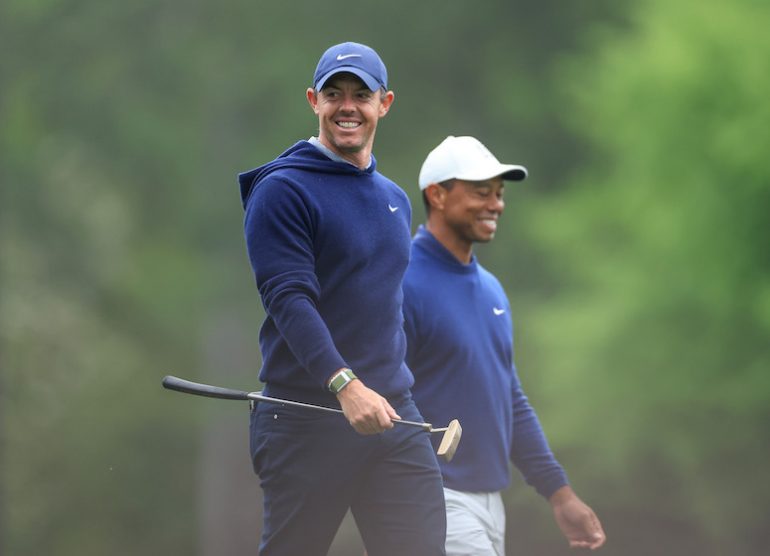 Rory McIlroy of Northern Ireland and Tiger Woods Photo by DAVID CANNON / David Cannon Collection / Getty Images via AFP