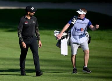 Matthieu Pavon of France walks with his caddie Photo by STUART FRANKLIN / GETTY IMAGES EUROPE / Getty Images via AFP