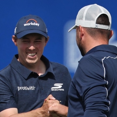 Matt Fitzpatrick (C) of England reacts with his brother and partner Alex Fitzpatrick Chris Graythen/Getty Images/AFP