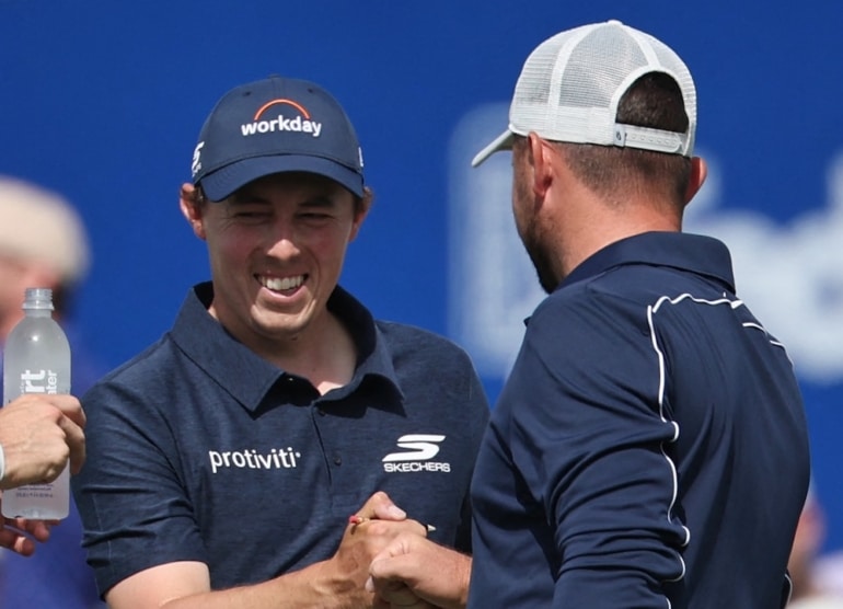 Matt Fitzpatrick (C) of England reacts with his brother and partner Alex Fitzpatrick Chris Graythen/Getty Images/AFP