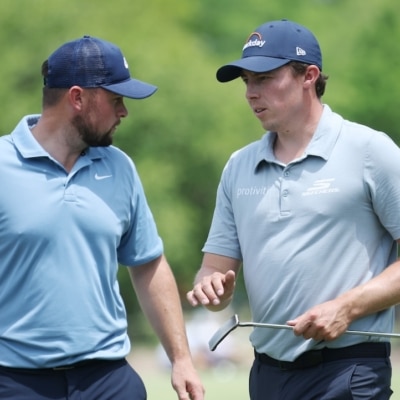 Matt Fitzpatrick (R) of England and brother Alex Fitzpatrick Photo by Chris Graythen / GETTY IMAGES NORTH AMERICA / Getty Images via AFP