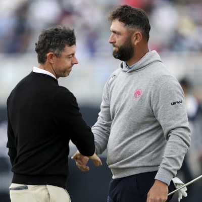 Rory McIlroy Jon Rahm Photo by Emilee Chinn / GETTY IMAGES NORTH AMERICA / Getty Images via AFP